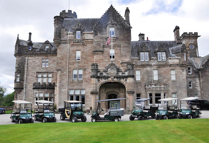 A selection of the vehicles in front of Skibo Castle, with the Cushman Refresher FS2 in the centre